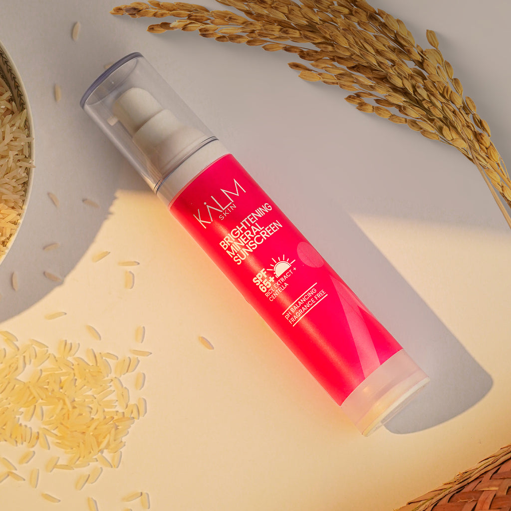 KALM SKIN Rice Brightening Sunscreen SPF50 displayed with rice extract ingredient for bright hydrated skin